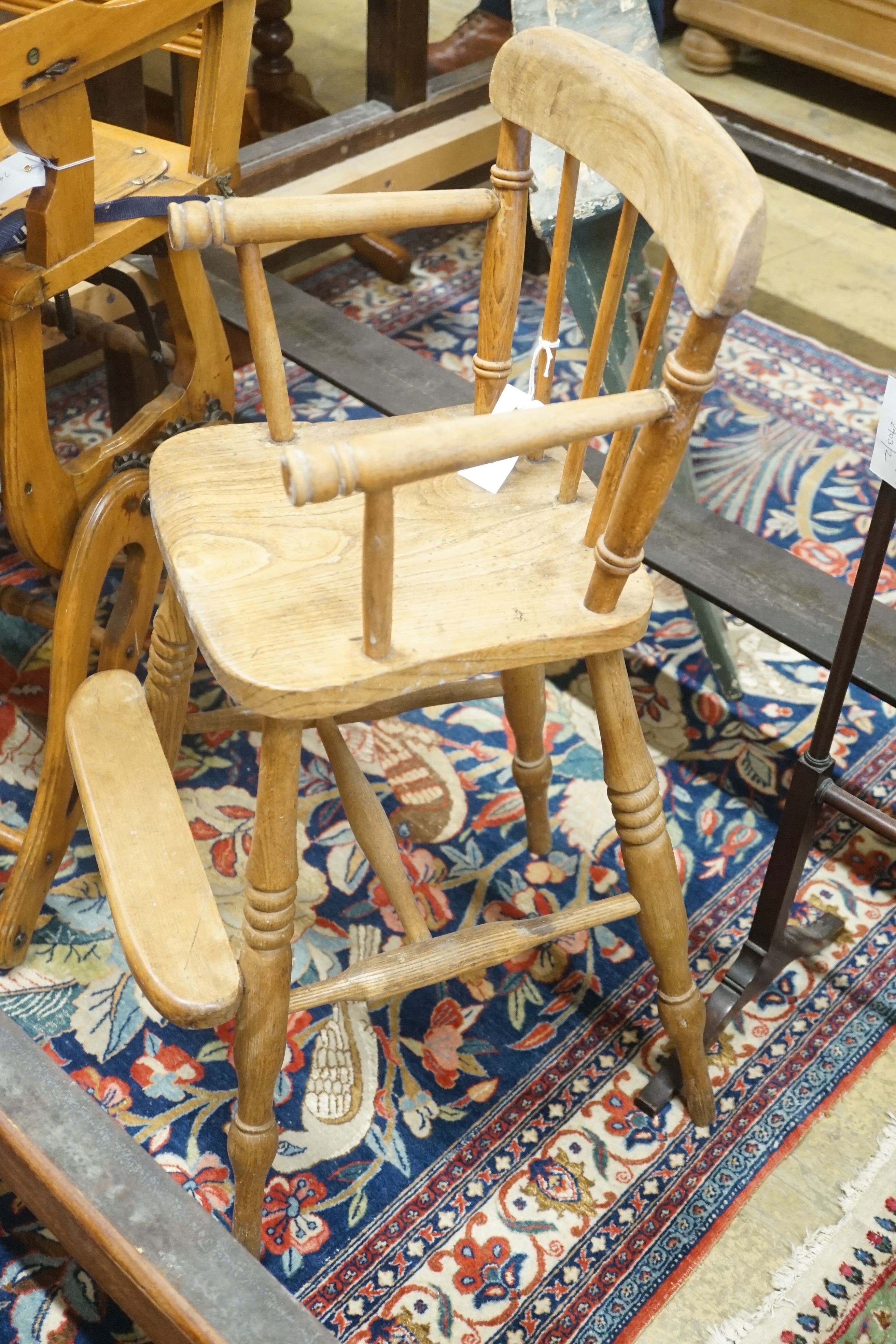 An early 20th century metamorphic child's high chair, together with a Victorian Windsor high chair